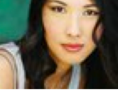 Woman with long hair, wearing a tank top.