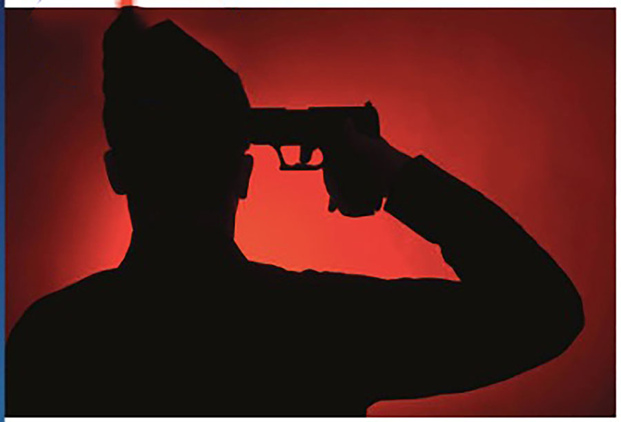Silhouette of person holding gun to head.