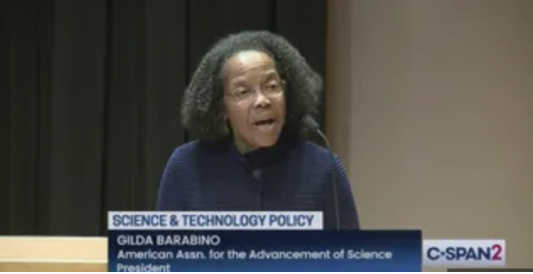 Woman speaking at a science and technology policy event.